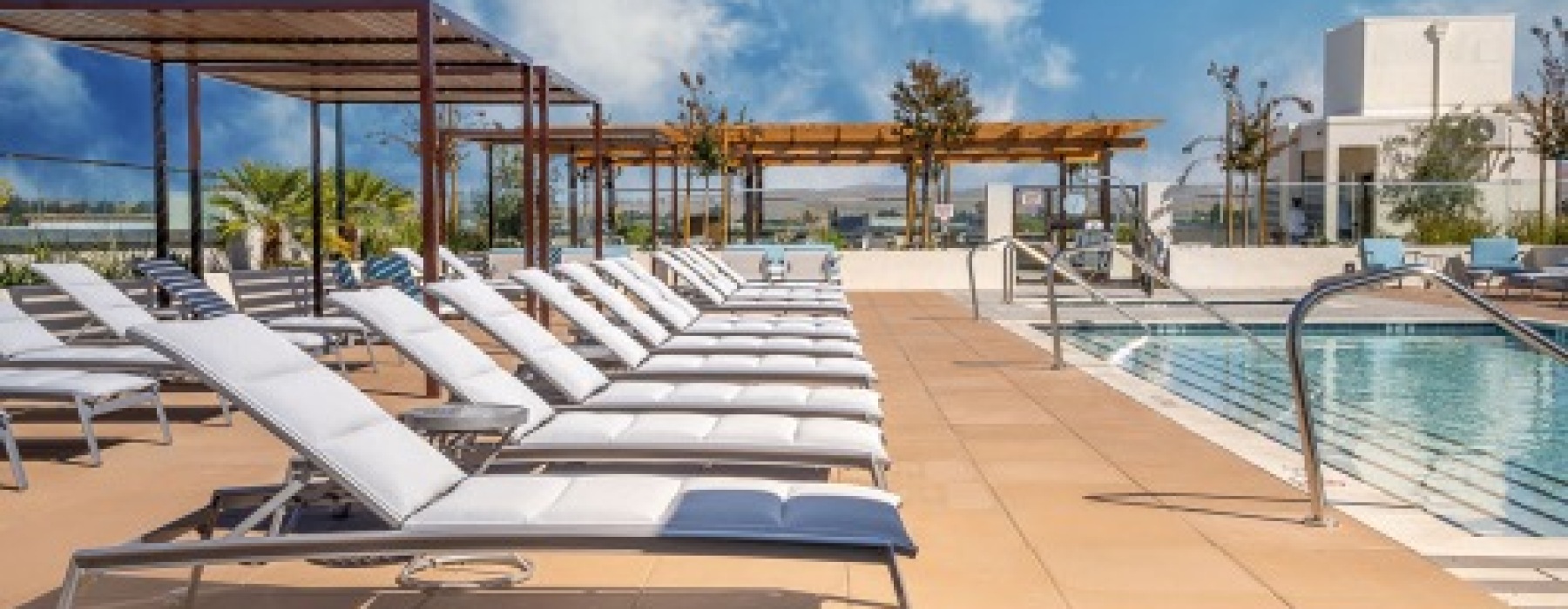 a pool with lounge chairs at Legacy at Livermore