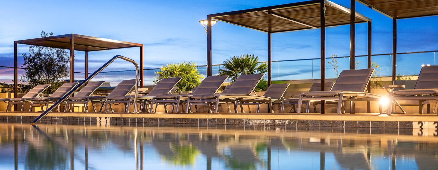 a pool with chairs and structures