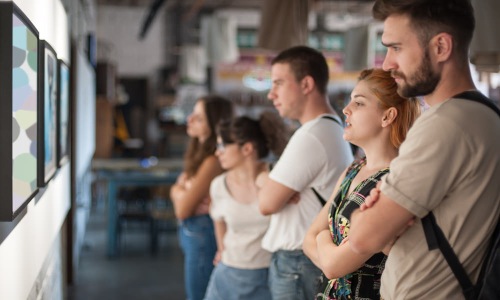 people staring at art