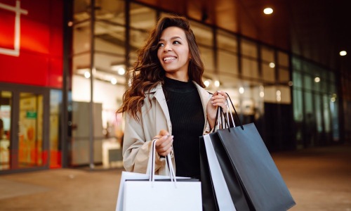 a woman holding shopping bags