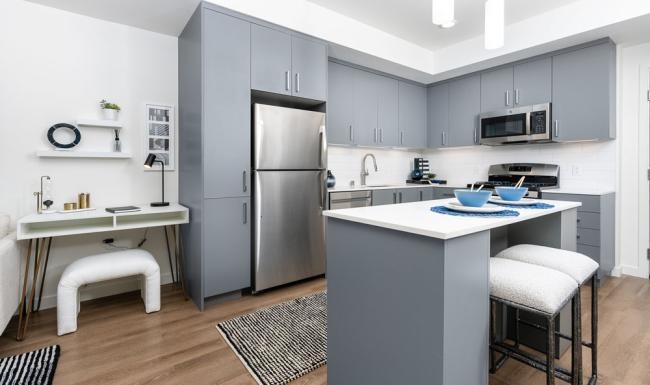 Beautiful kitchens with designer finishes a kitchen with a table and chairs