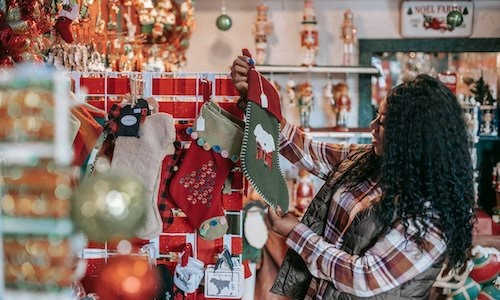 a woman shopping for Christmas decorations