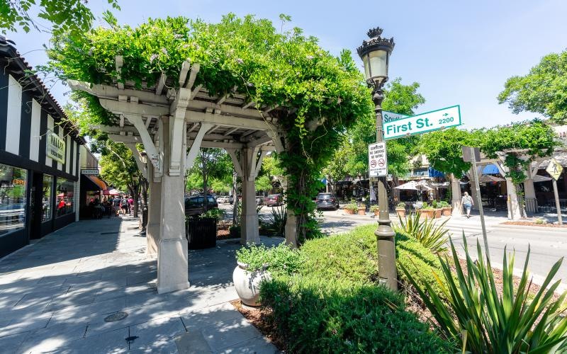 The essence of exceptional living a street sign on a sidewalk